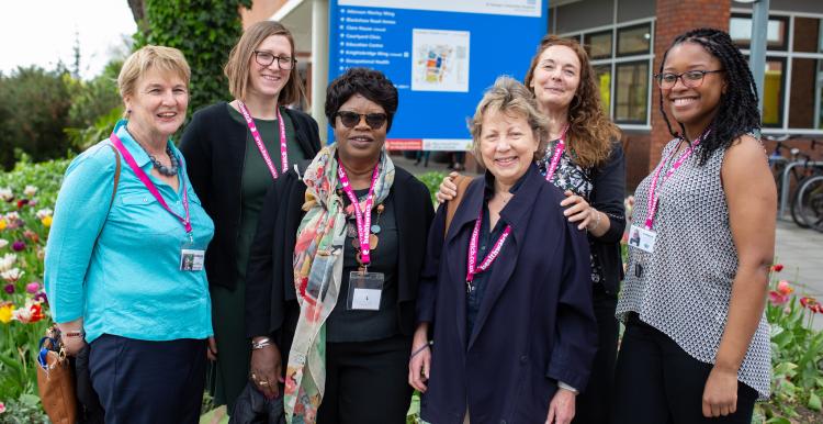 Group of women who work for Healthwatch, standing outside a hospital