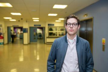 man standing in hallway 