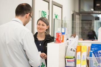 lady speaking to pharmacist