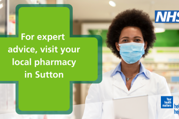 pharmacist wearing a mask standing behind a counter